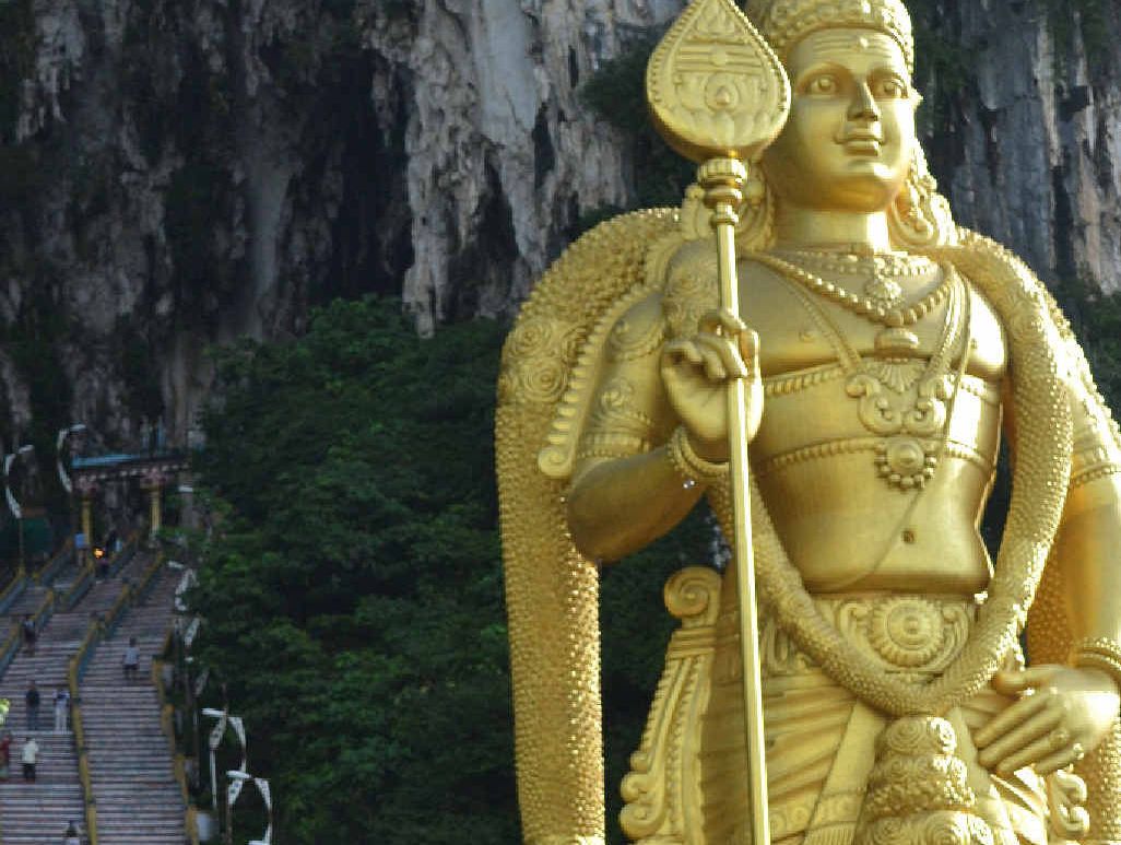 The famous Batu Caves and the infamous staircase to an ancient Hindu temple overlooked by the large golden statue of Lord Murugan. The famous Batu Caves and the infamous staircase to an ancient Hindu temple overlooked by the large golden statue of Lord Murugan.